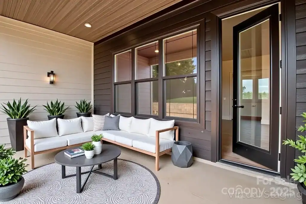 130384ed35e42cff405407f29ae1b74f-uncropped_scaled_within_1536_1152 Modern outdoor patio with cozy seating area, stylish decor, and lush potted plants for relaxing outdoor living.