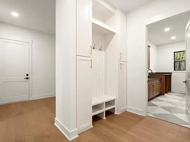 7bb07973d94889ff9580cf5f2ef618f6-cc_ft_768 Modern white built-in storage bench and coat hooks in a bright, newly renovated home.