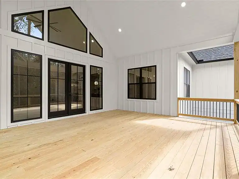 ba7af9fb73d0e666a9a0a9fae4c2504c-cc_ft_768 Modern interior of a new construction home with large windows and natural wood flooring.